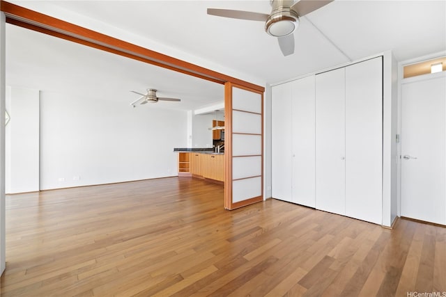 322 Aoloa St Unit 907, Kailua, HI 96734 - unfurnished living room with ceiling fan and wood finished floors