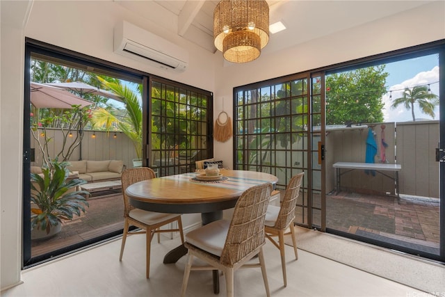 6129 Summer St Unit 6129D, Honolulu, HI 96821 - dining room featuring a wall mounted AC and a chandelier