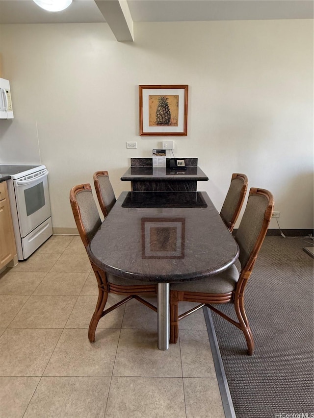 229 Paoakalani Ave Unit 1803, Honolulu, HI 96815 - dining room with baseboards and light tile patterned floors