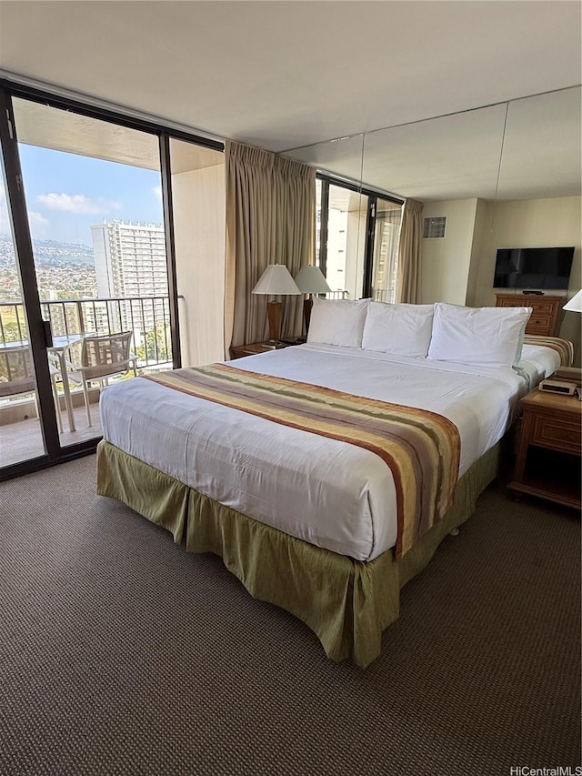 229 Paoakalani Ave Unit 1803, Honolulu, HI 96815 - carpeted bedroom featuring expansive windows, access to exterior, and visible vents