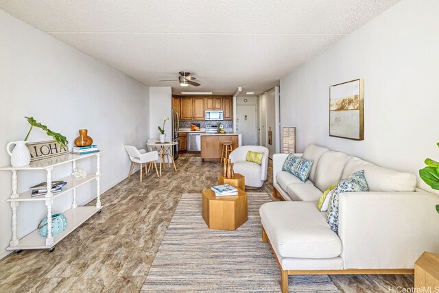 living area featuring ceiling fan and light wood-style floors