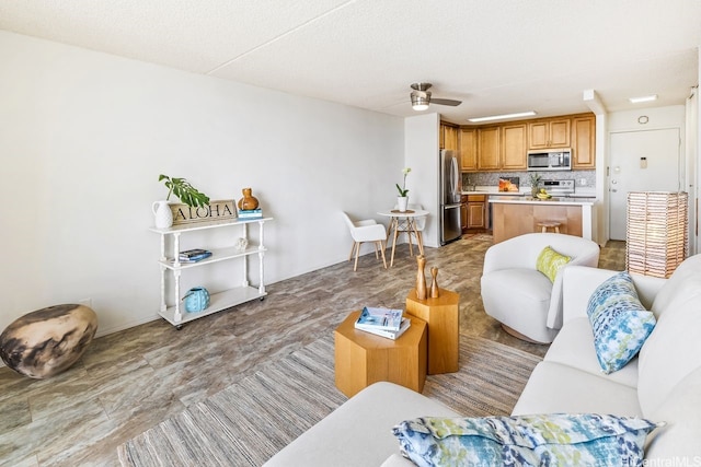 living area featuring ceiling fan