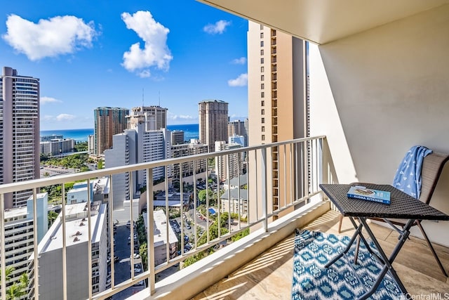 balcony with a city view and a water view