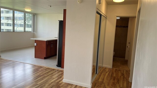 95-29 Kuahelani Ave Unit 226, Mililani, HI 96789 - hallway featuring light wood-style floors and baseboards