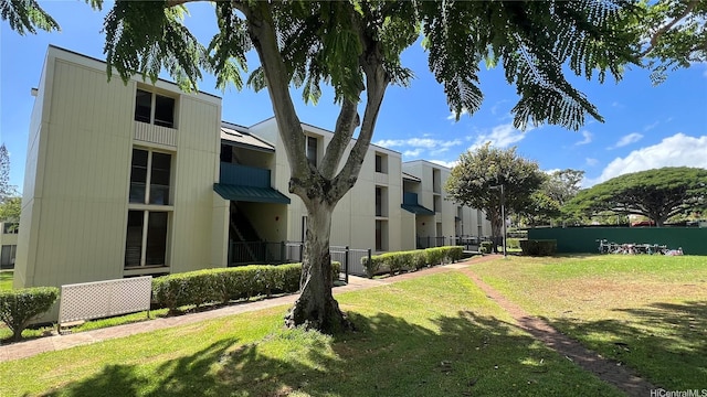 view of building exterior with fence