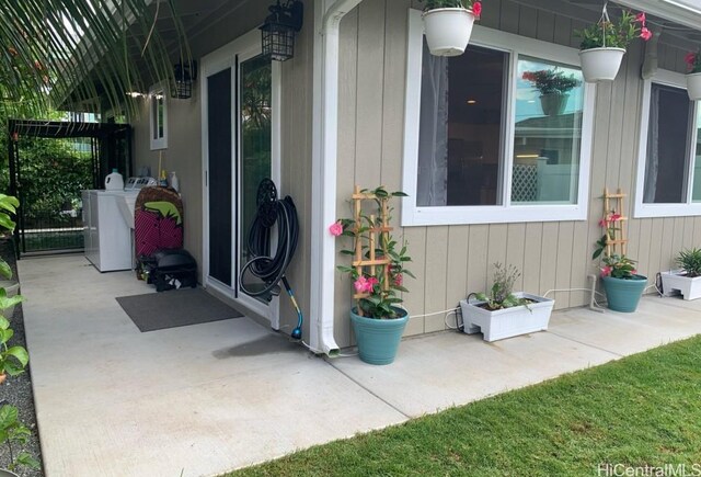 exterior space featuring washing machine and dryer and a patio