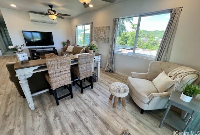 home office with light wood-type flooring, baseboards, recessed lighting, a ceiling fan, and a wall mounted AC