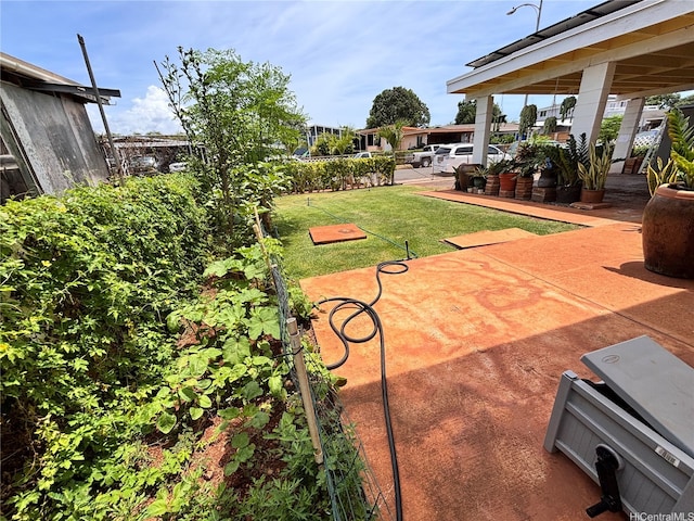 91-692 Kilinahe St, Ewa Beach, HI 96706 - exterior space with a patio and a lawn