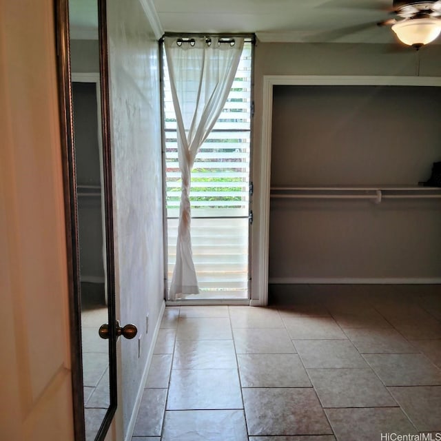 unfurnished bedroom featuring baseboards and tile patterned floors