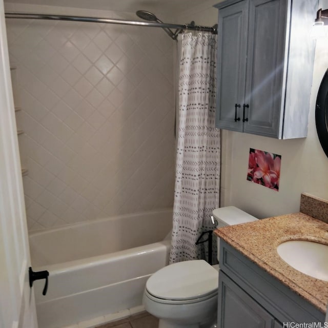 bathroom featuring vanity, shower / tub combo with curtain, and toilet