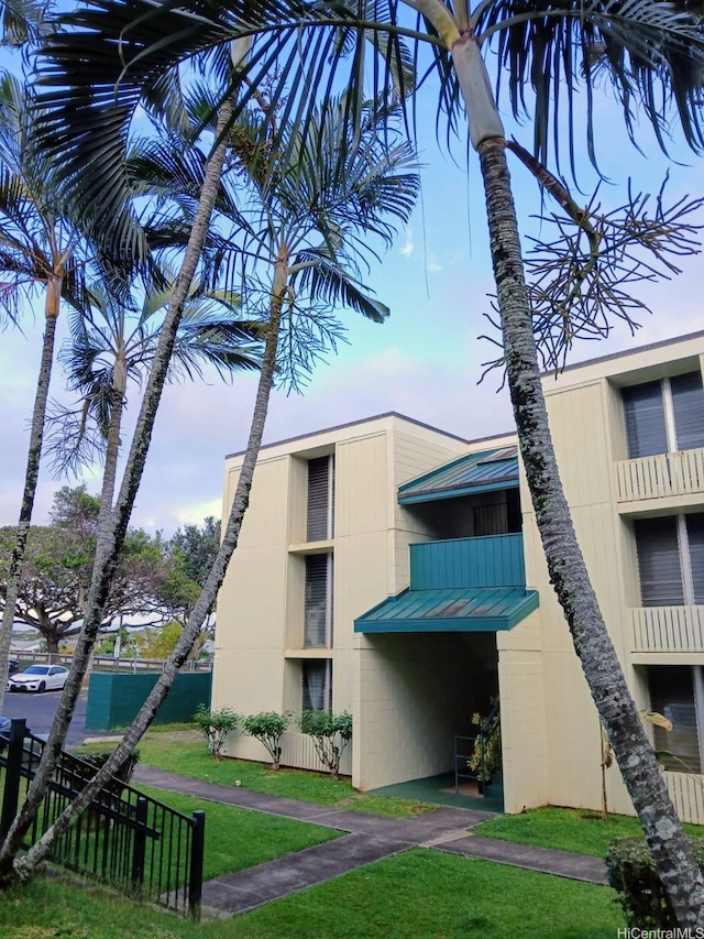 view of building exterior with fence