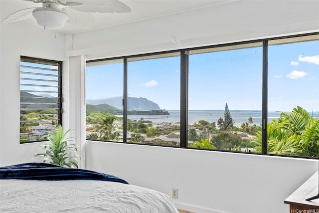 46-058 Aliikane Pl Unit 2123, Kaneohe, HI 96744 - bedroom with a water and mountain view, ceiling fan, and baseboards