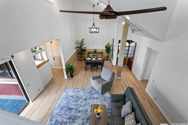 46-058 Aliikane Pl Unit 2123, Kaneohe, HI 96744 - living room featuring wood finished floors, a ceiling fan, a towering ceiling, and baseboards