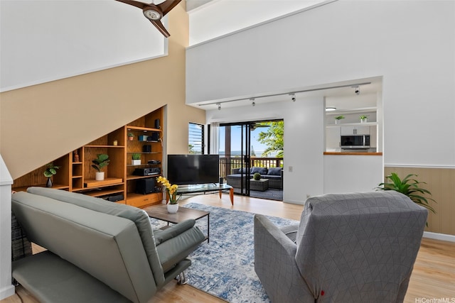 46-058 Aliikane Pl Unit 2123, Kaneohe, HI 96744 - living room featuring wood finished floors and rail lighting
