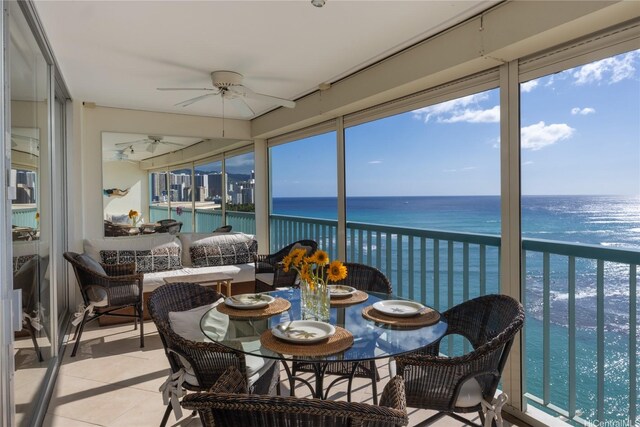 2877 Kalakaua Ave Unit 1105, Honolulu, HI 96815 - sunroom featuring a water view, a view of the beach, and tile patterned floors