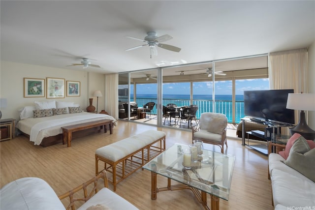 2877 Kalakaua Ave Unit 1105, Honolulu, HI 96815 - bedroom featuring floor to ceiling windows, wood finished floors, and access to exterior