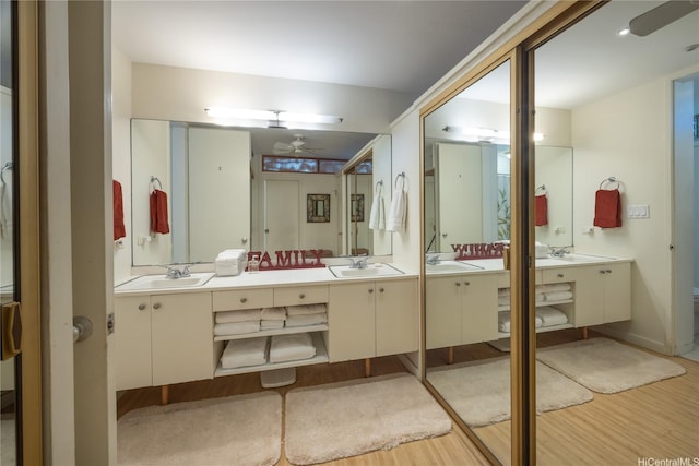 2877 Kalakaua Ave Unit 1105, Honolulu, HI 96815 - full bath with double vanity, wood finished floors, ceiling fan, and a sink