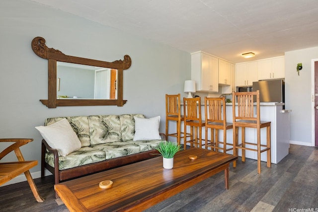 53-549 Kamehameha Hwy Unit 505, Hauula, HI 96717 - living area featuring dark wood-style flooring and baseboards