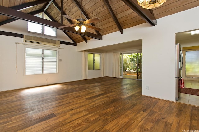 spare room with a wall unit AC, lofted ceiling with beams, wood ceiling, wood finished floors, and ceiling fan with notable chandelier
