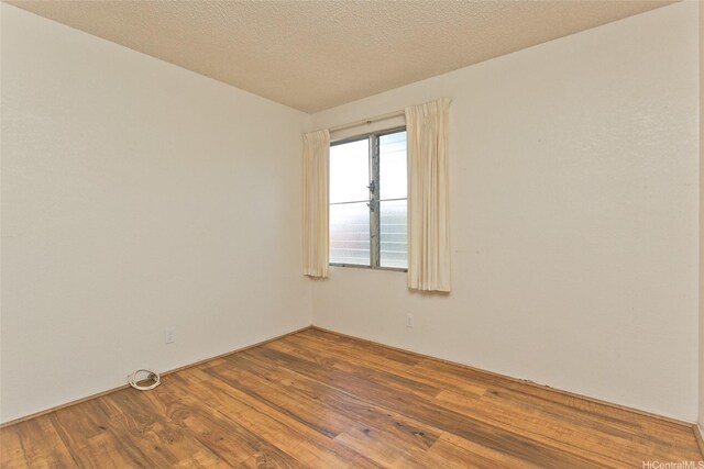 empty room featuring wood finished floors