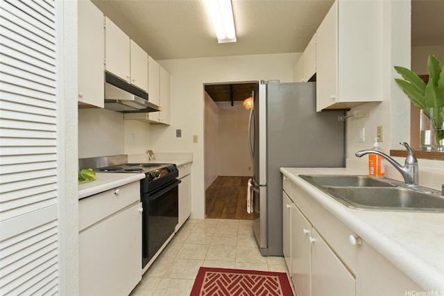 kitchen featuring under cabinet range hood, light countertops, a sink, white cabinetry, and black range with electric cooktop