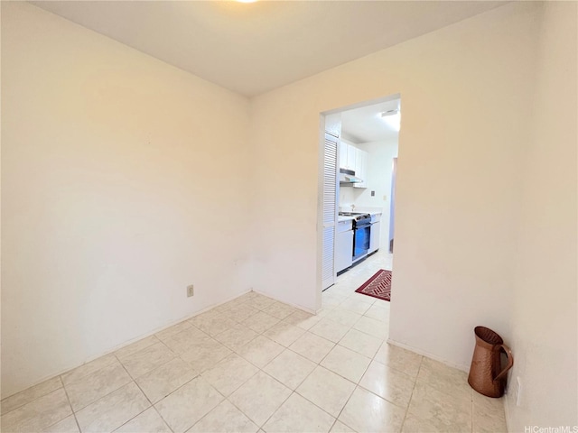 spare room with light tile patterned floors