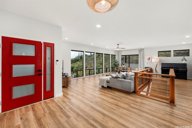 living room with recessed lighting and light wood-type flooring