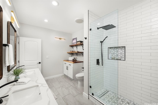 bathroom with baseboards, walk in shower, recessed lighting, vanity, and marble finish floor