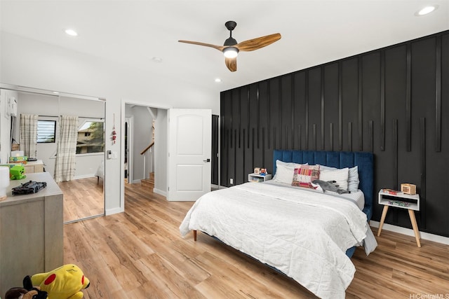 bedroom featuring light wood-type flooring, recessed lighting, a ceiling fan, and baseboards