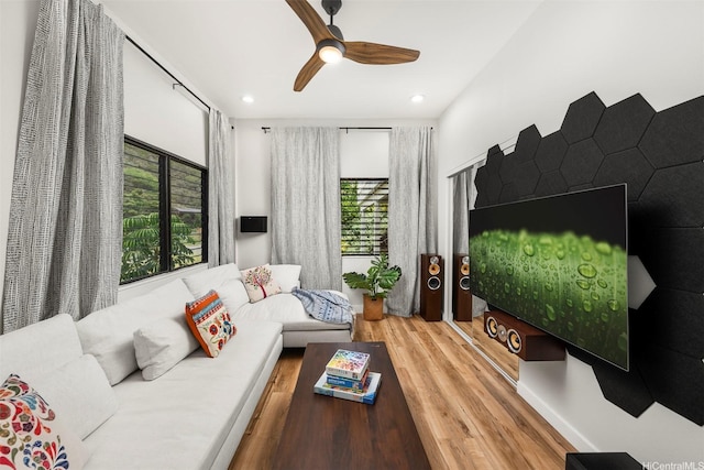 living room featuring wood finished floors, ceiling fan, and recessed lighting