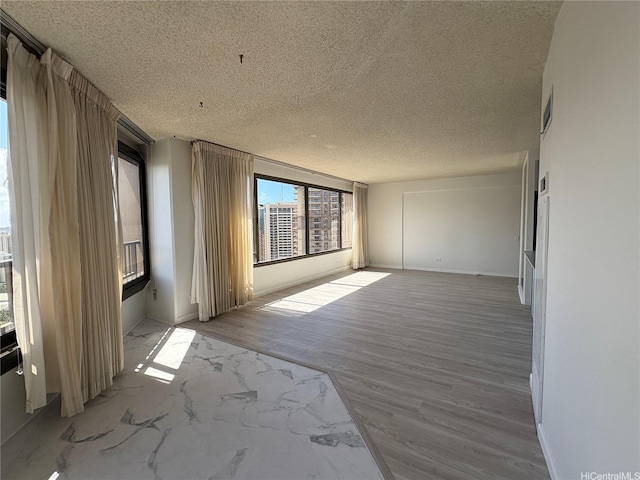 1778 Ala Moana Blvd Unit 3616, Honolulu, HI 96815 - empty room featuring a textured ceiling and baseboards