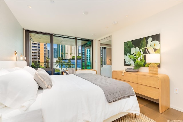 1388 Ala Moana Blvd Unit 1405, Honolulu, HI 96814 - bedroom with expansive windows, light wood finished floors, and access to exterior