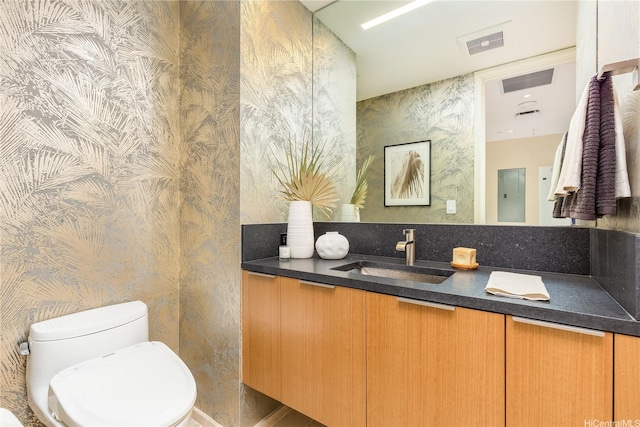 1388 Ala Moana Blvd Unit 1405, Honolulu, HI 96814 - bathroom featuring wallpapered walls, toilet, and vanity