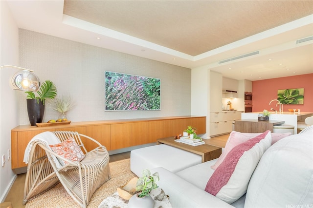 1388 Ala Moana Blvd Unit 1405, Honolulu, HI 96814 - living room featuring light wood-style floors, a tray ceiling, and recessed lighting