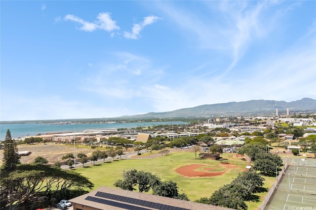 drone / aerial view featuring a water and mountain view