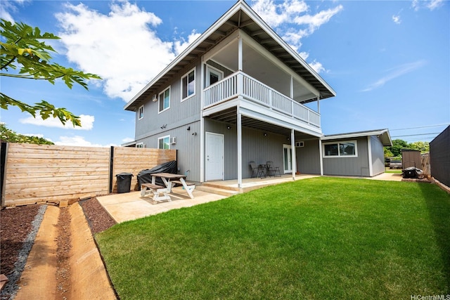 91-444 Pohakupuna Rd, Ewa Beach, HI 96706 - rear view of property featuring a lawn, a patio, fence, and a balcony