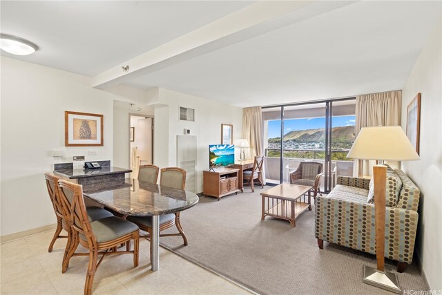 229 Paoakalani Ave Unit 1413, Honolulu, HI 96815 - dining room with a wall of windows, visible vents, light tile patterned floors, and baseboards