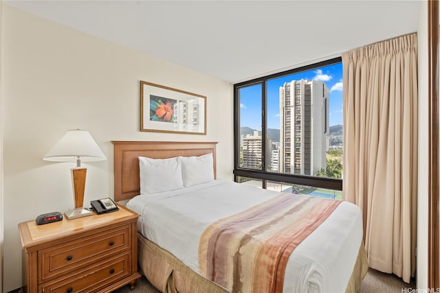 229 Paoakalani Ave Unit 1413, Honolulu, HI 96815 - bedroom featuring a view of city and expansive windows