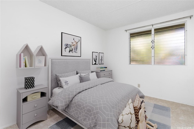 carpeted bedroom featuring baseboards