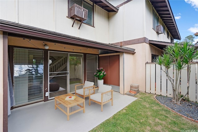 rear view of property with a patio and fence