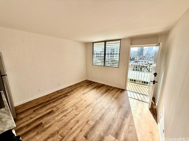 2122 Lime St Unit 604, Honolulu, HI 96826 - spare room featuring wood finished floors and baseboards
