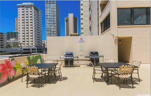2410 Cleghorn St Unit 502, Honolulu, HI 96815 - view of patio / terrace with a view of city, area for grilling, and outdoor dining space