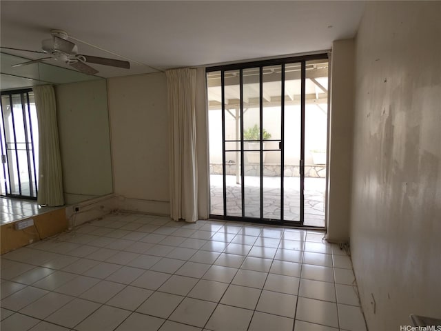 2410 Cleghorn St Unit 502, Honolulu, HI 96815 - unfurnished room with expansive windows, ceiling fan, and light tile patterned floors