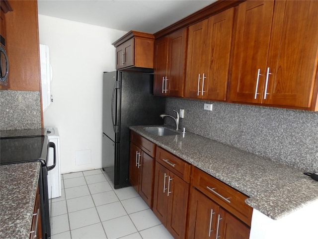 2410 Cleghorn St Unit 502, Honolulu, HI 96815 - kitchen featuring black appliances, backsplash, and dark stone countertops