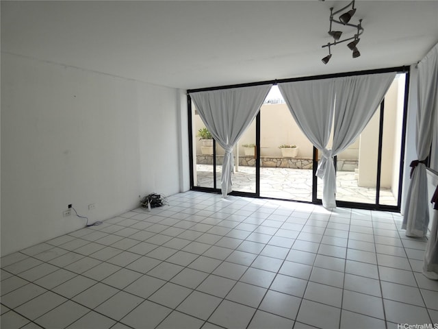 2410 Cleghorn St Unit 502, Honolulu, HI 96815 - spare room with expansive windows and tile patterned floors