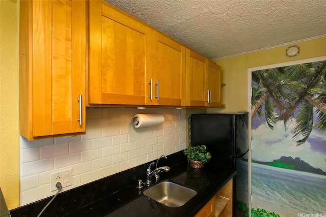 1920 Ala Moana Blvd Unit 2013, Honolulu, HI 96815 - kitchen with a textured ceiling, dark countertops, a sink, and tasteful backsplash