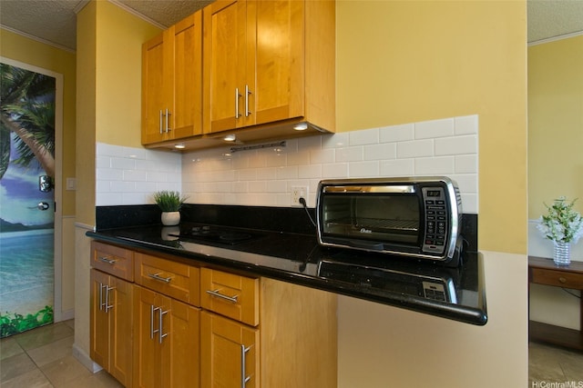 1920 Ala Moana Blvd Unit 2013, Honolulu, HI 96815 - kitchen featuring a toaster, decorative backsplash, ornamental molding, and a textured ceiling