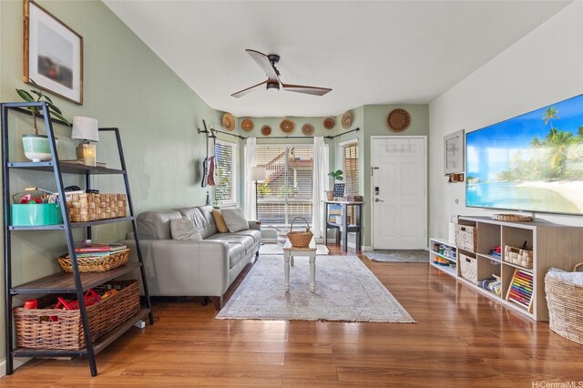 living room with ceiling fan and wood finished floors