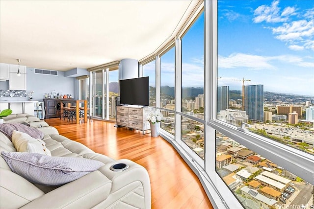 1296 Kapiolani Blvd Unit 3403, Honolulu, HI 96814 - living area featuring light wood-style flooring and floor to ceiling windows