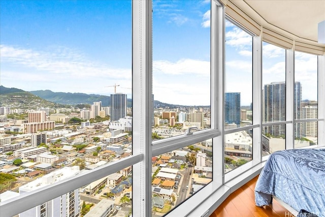 1296 Kapiolani Blvd Unit 3403, Honolulu, HI 96814 - bedroom featuring a city view, wood finished floors, and a mountain view
